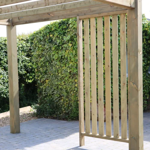 Timber gazebo with sides on a patio in a private garden.