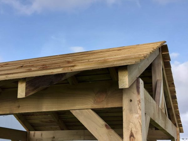 Feather edge roof planks on a barbeque shelter